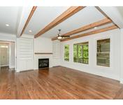 Living Room with Custom Built-Ins and Cedar Beams